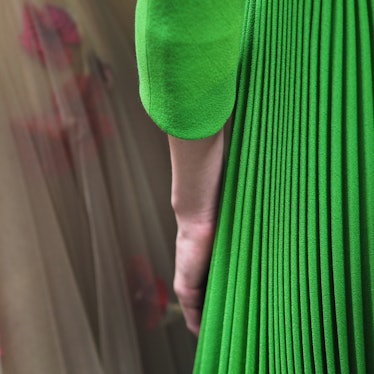 A model in a green pleated dress during Christian Dior Haute Couture Spring 2017.
