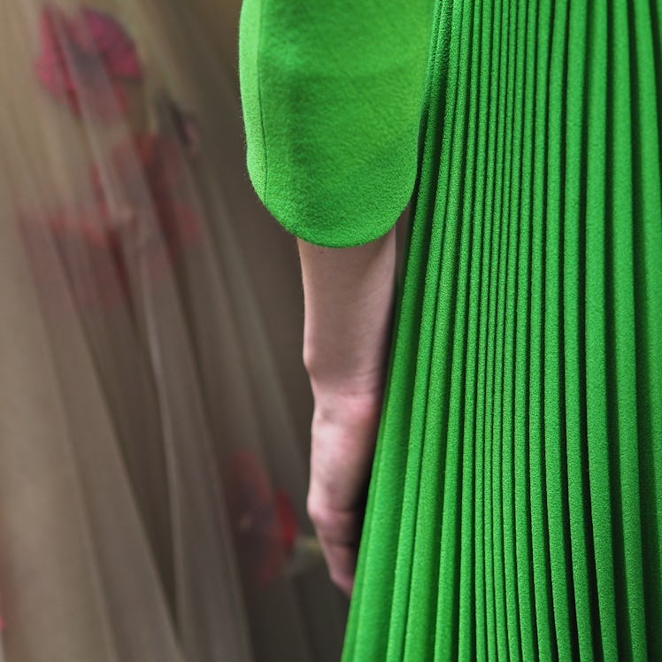 A model in a green pleated dress during Christian Dior Haute Couture Spring 2017.