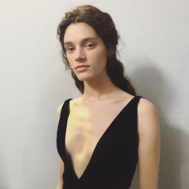 A model wearing Dior Haute Couture Spring 2017 black cocktail dress.