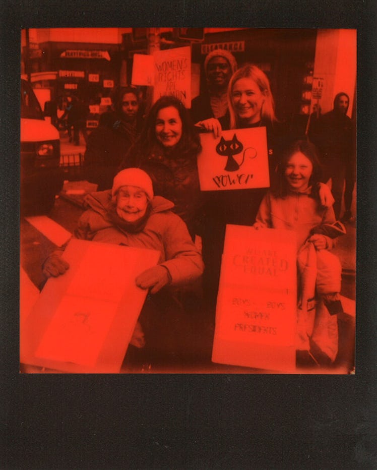 Six women posing for a photo at the Women’s March in NYC