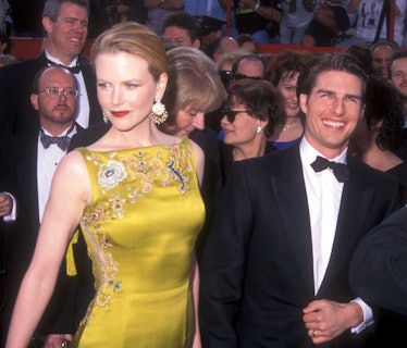 Nicole Kidman in a yellow dress with Tom Cruise in a tuxedo at the Oscars 