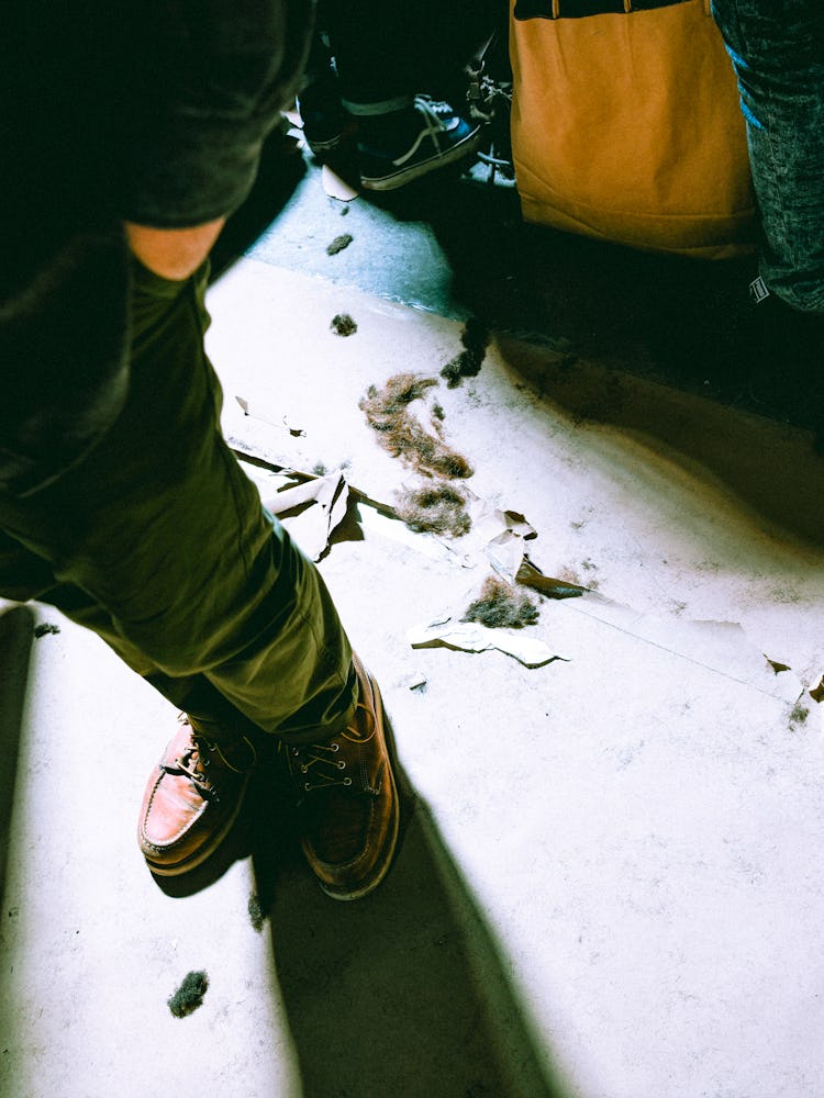 Trimmed hair on the floor backstage before the presentation of Raf Simons A/W ’17 Collection.