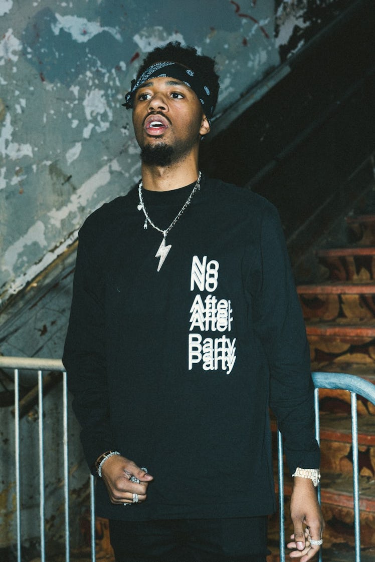 Metro Boomin in a black sweatshirt with the text 'No After Party' and a black bandana on his forehea...