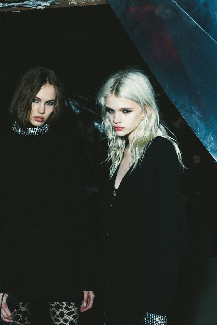 A brunette and a blonde model in black dresses at the Alexander Wang Fall 2017 show