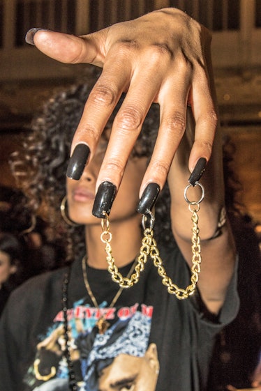 A model showing off gold chain nail art at the Philipp Plein show during New York Fashion Week.