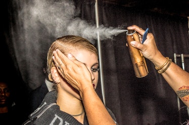Sofia Richie getting her hair done backstage before walking in Philipp Plein’s Fall 2017 runway show...