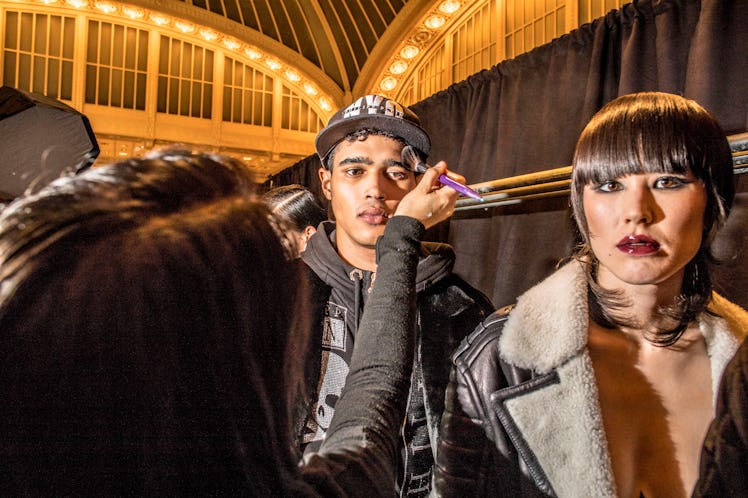 Models getting their makeup fixed before heading out to hit the runway at Philipp Plein’s Fall 2017 ...