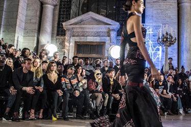 Carine Roitfeld, Tyga, Kylie Jenner, and Madonna sitting in front at Philipp Plein’s runway show dur...