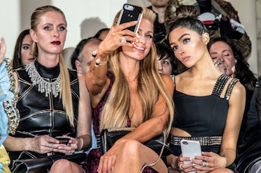 Nicky Hilton Rothschild, Paris Hilton and Olivia Culpo taking a selfie before the Philipp Plein fash...