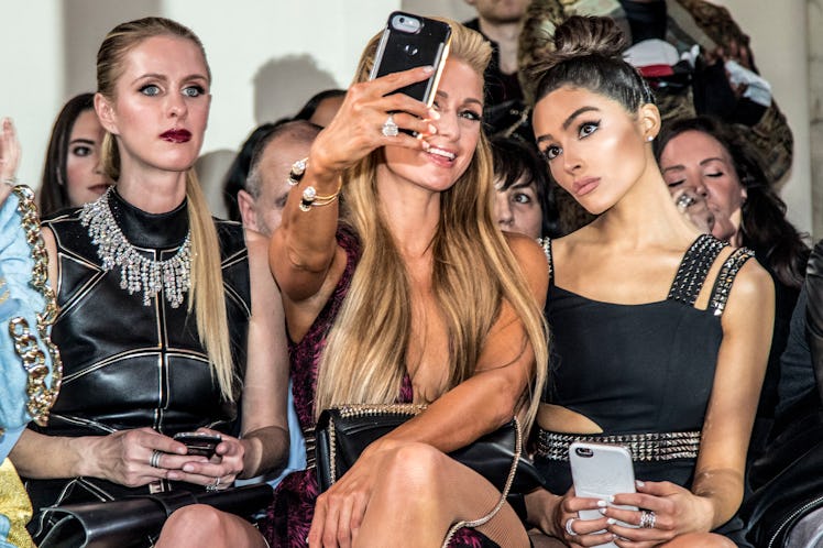 Nicky Hilton Rothschild, Paris Hilton and Olivia Culpo taking a selfie before the Philipp Plein fash...