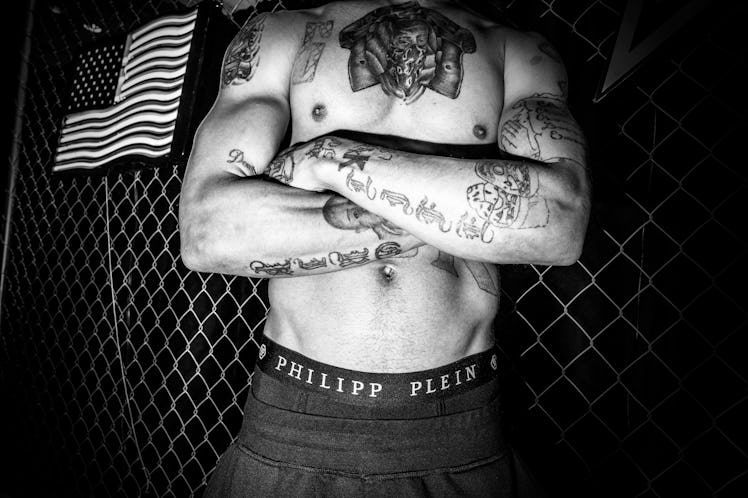 A shirtless model wearing Philipp Plein-branded underwear 