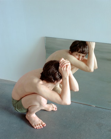 Crouching Boy in Mirror.jpg