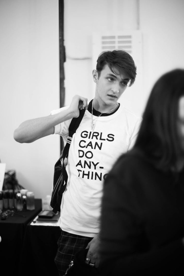 Anwar Hadid backstage at Zadig & Voltaire Fall 2017 show in a shirt that says "girls can do anything...
