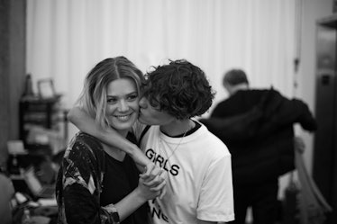 Dominique Rinderknecht being kissed on the cheek by another model backstage at the Zadig & Voltaire ...