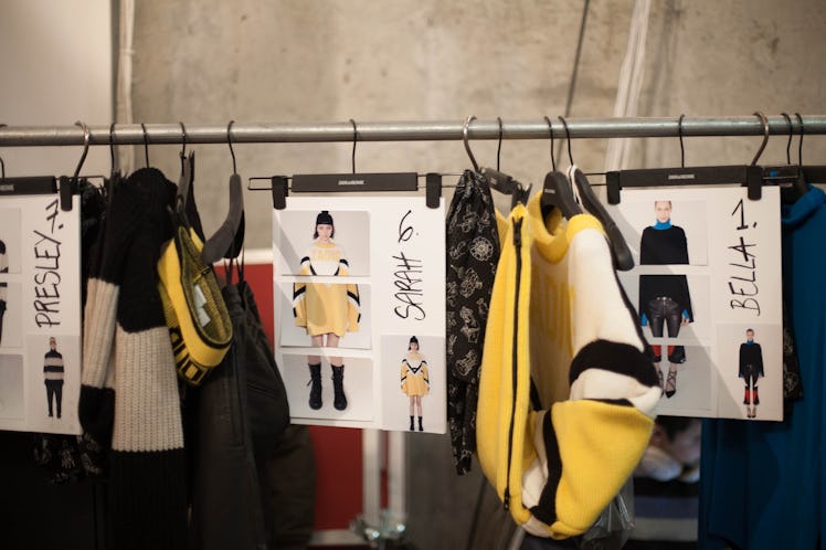 Sketches and jackets hanging on a rack backstage at the Zadig & Voltaire Fall 2017 show 