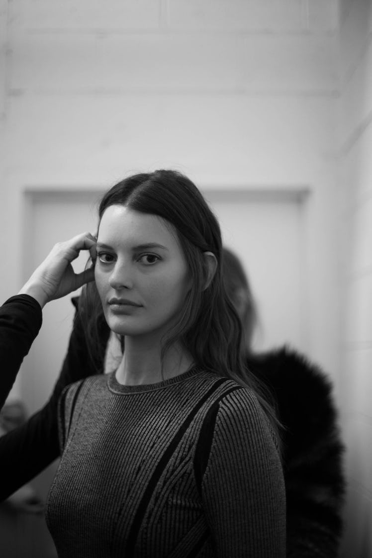 A model getting her hair touched up backstage at the Zadig & Voltaire Fall 2017 show