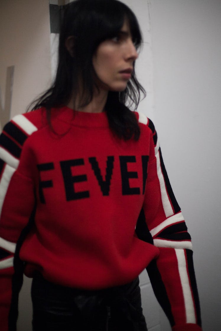 Jamie Bochert backstage at Zadig & Voltaire Fall 2017 in a black, white and red sweater that says "F...