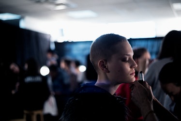 A model getting her makeup done backstage at Monse Fall 2017