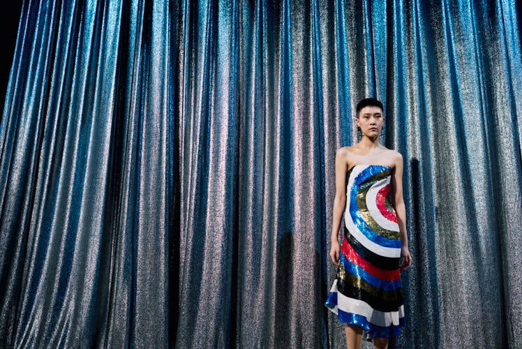 A model wearing a red-white-blue-black dress at Monse Fall 2017