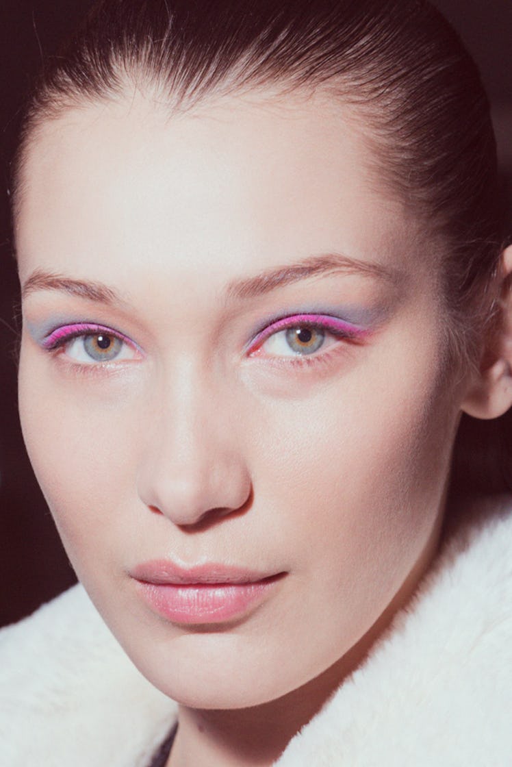 A close-up portrait of Bella Hadid with pink eyeshadow at Oscar de la Renta Fall 2017