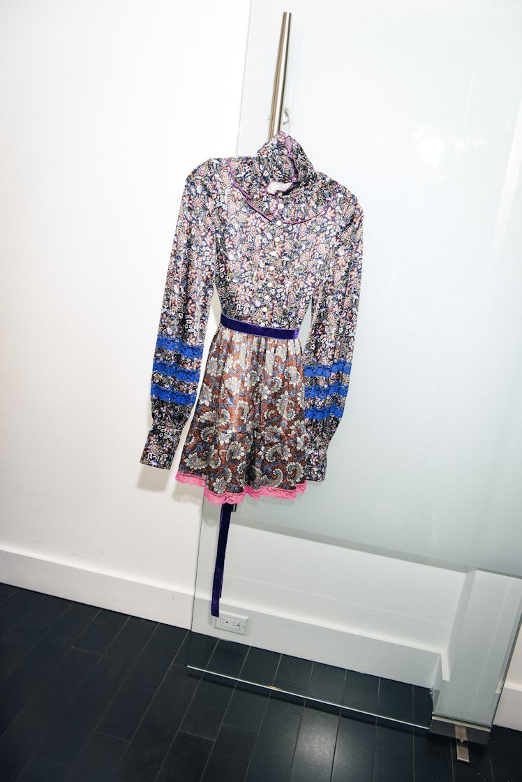 A silver sequined dress hanged on the wall