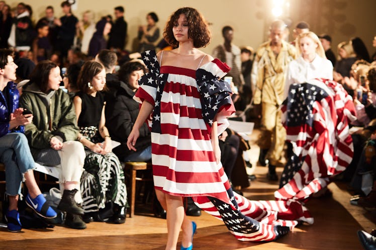A model walking while wearing an American flag-inspired gown at the Vaquera Debut Show at New York F...