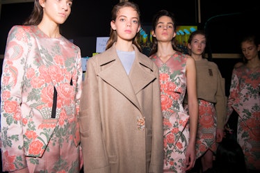 Five models in beige-orange floral dresses and coats at the  Christopher Kane Fall 2017 show