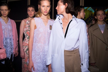 Two models in white blouses, two models in floral dresses and a model in a beige coat at the Christo...