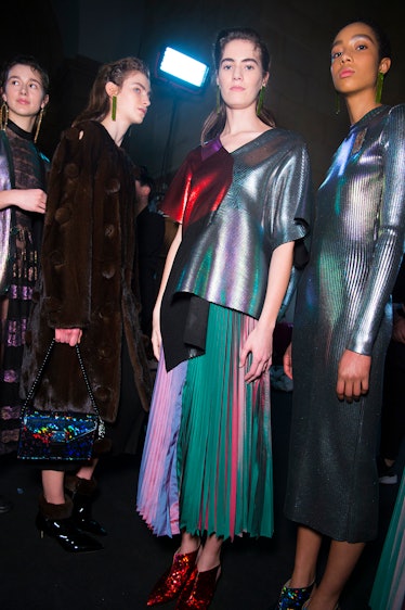 Two models in green-purple dresses and two models in velvet coats at the  Christopher Kane Fall 2017...