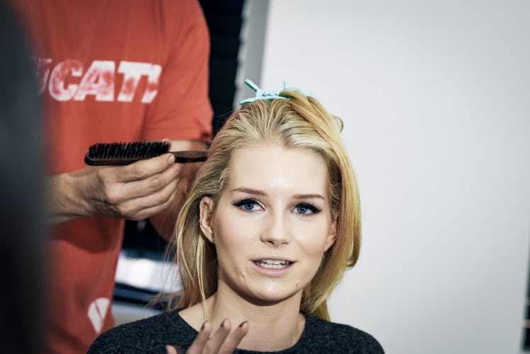 Lottie Moss talking during her hair treatment