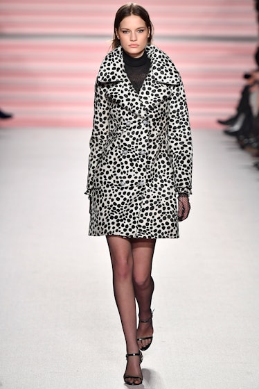 A female model walking in a mod black and white leopard coat designed by Philosphy Di Lorenzo Serafi...