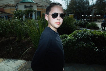 A boy wearing dark shades posing for a photo in Calabasas