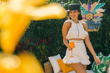 Eiza Gonzalez in a white two-piece and a black hat at Veuve Clicquot’s Third Annual Carnaval party i...