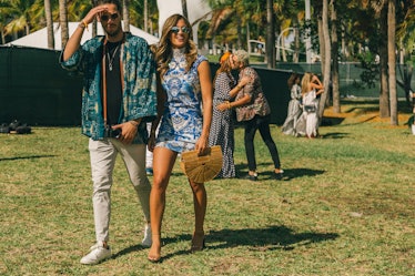 A couple arriving at Veuve Clicquot’s Third Annual Carnaval party in Miami.