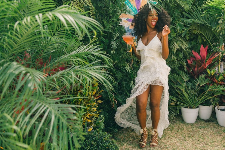 A woman in a white dress posing for a photo at Veuve Clicquot’s Third Annual Carnaval party in Miami...