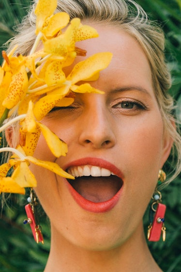 Karolina Kurkova posing with yellow flowers during Veuve Clicquot’s Third Annual Carnaval party in M...