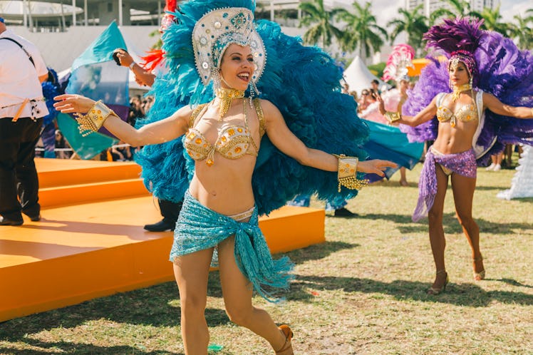 Dancers performing in their carnival costumes at Veuve Clicquot’s Third Annual Carnaval party in Mia...
