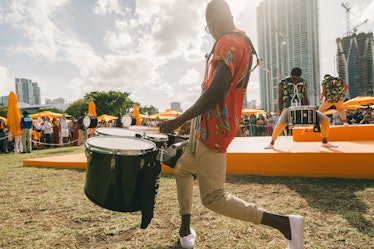 A man playing drums at Veuve Clicquot’s Third Annual Carnaval party in Miami.