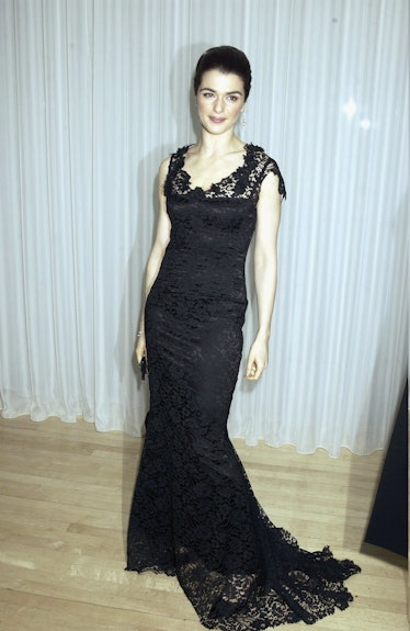 Rachel Weisz posing while wearing a black gown