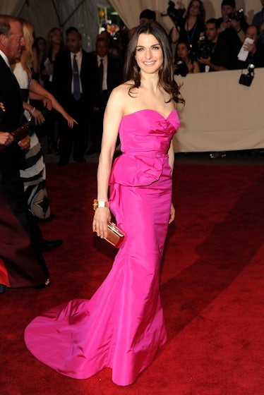 Rachel Weisz posing while wearing a pink gown