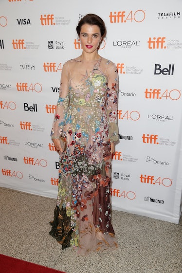 Rachel Weisz posing in a floral Valentino gown