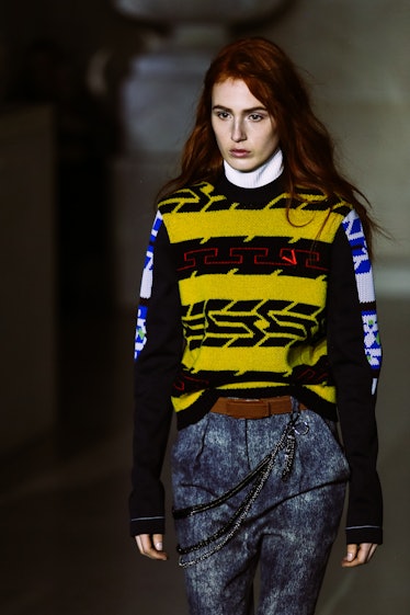 A model wearing a sweater and pants from Louis Vuitton’s Fall 2017 collection.