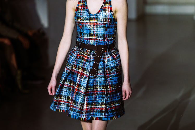 A model wearing a blue plaid dress from Louis Vuitton’s Fall 2017 collection.