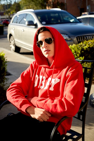 A boy wearing shades and a pink hoodie in Calabasas