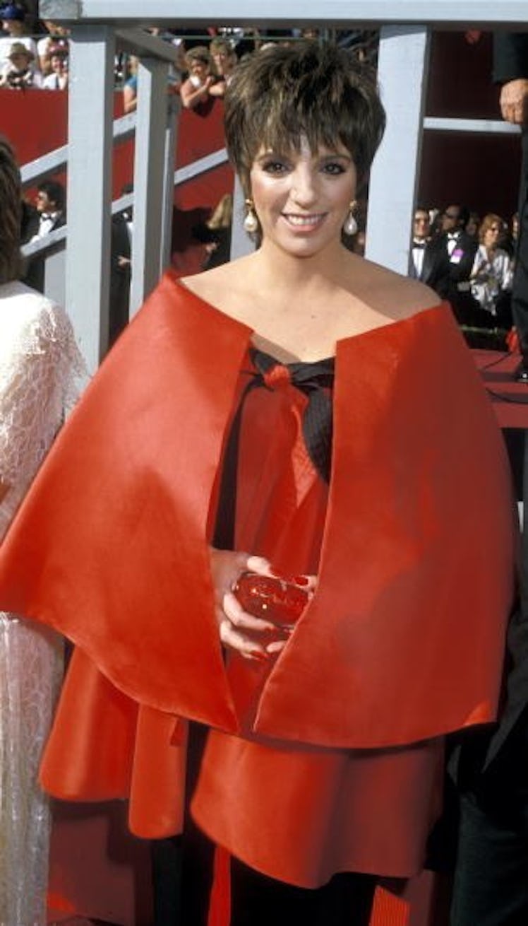 Liza wears a red gown