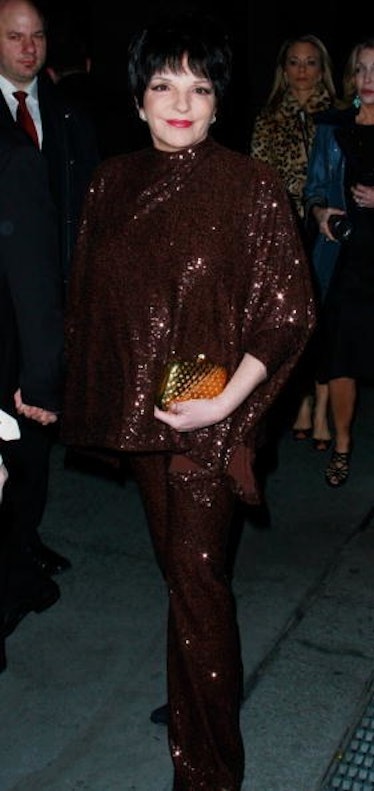 Liza wears maroon sparkling ensemble