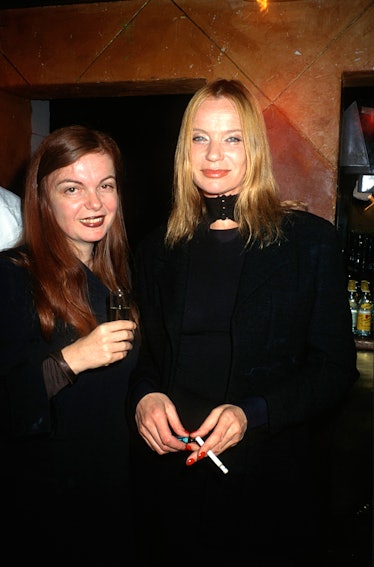 Martine Sitbon, a Chloé’s revered designer, posing for a photograph with a friend while holding a sh...