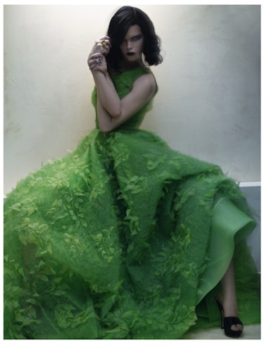 A female model posing in a green gown on St. Patrick’s Day