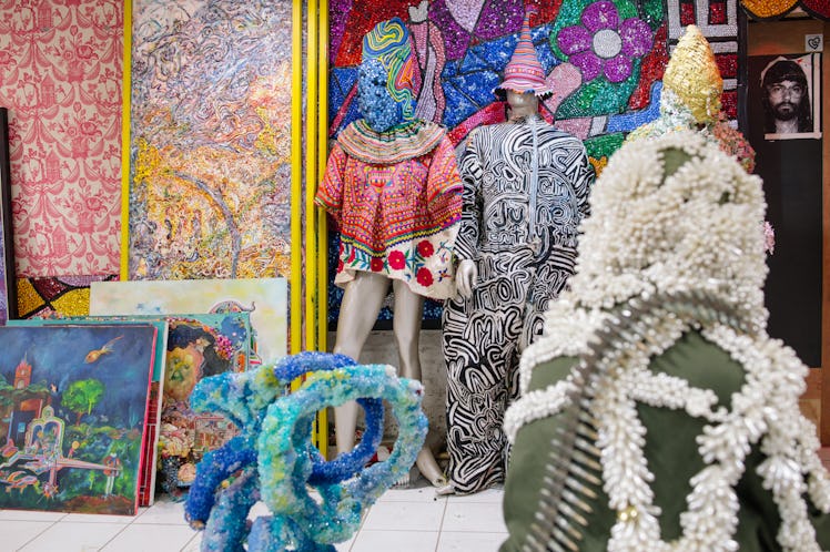 Mannequins dressed in Raúl de Nieves' bead-covered creations inside his Brooklyn Studio