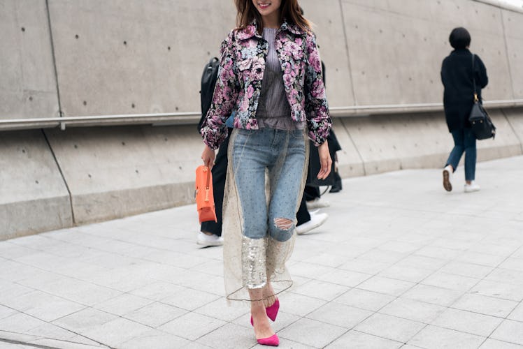 A chic trendsetter flaunting her impeccable fashion sense during Seoul Fashion Week.